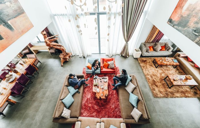 Spacious and elegant living room with modern furniture and decor, capturing a luxurious vibe.