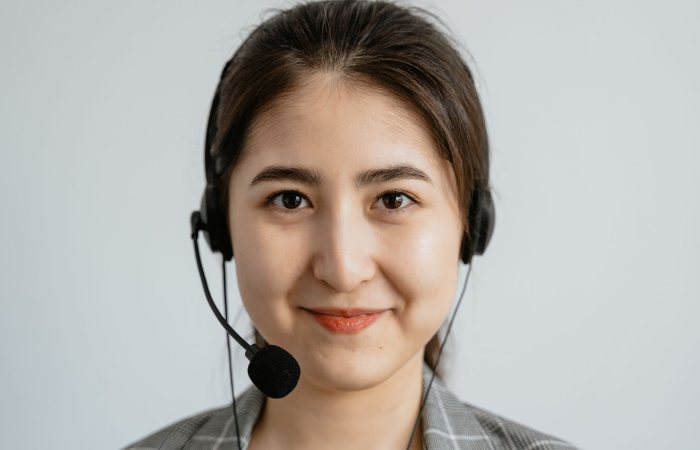 Portrait of a smiling customer service representative with a headset.