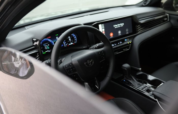 High-tech interior of a modern car featuring dashboard and digital display.