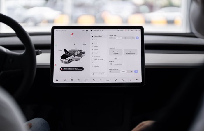 View of a modern car's dashboard featuring a digital display panel with control options.